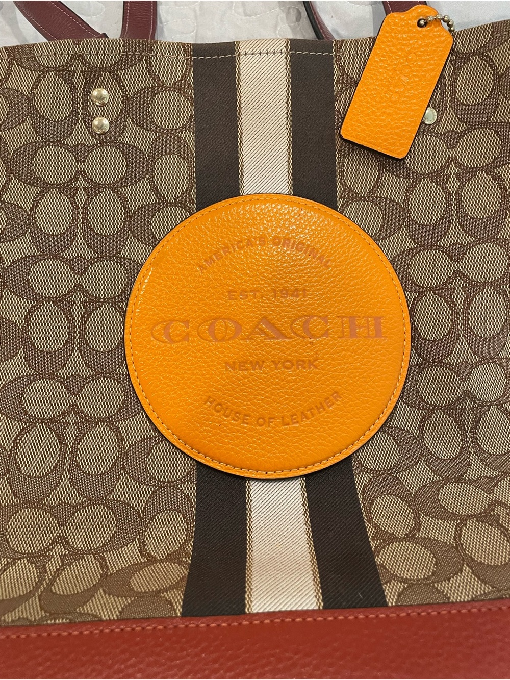 Coach Brown Signature Tote with Bright Orange Patch and Tag